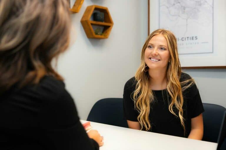 adult having a consultation about Invisalign at Greg Brown Orthodontics